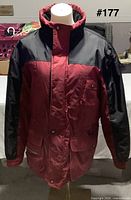 Front view of Yukon Trail red and black jacket on mannequin