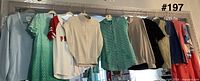 Row of ten hanging tops and sweaters