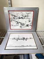Both matted prints displayed together