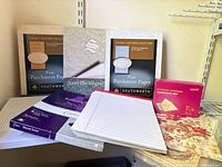 Group view of parchment paper boxes, resume paper, ruled pad, envelopes, scrapbooking paper