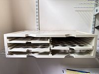 Front view showing all six trays and color