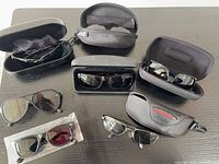 All seven eyewear items displayed with their cases