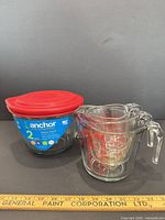 batter bowl with lid beside measuring cup