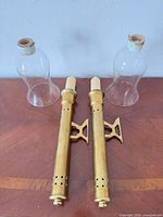 Pair of brass sconces and two glass shades on table