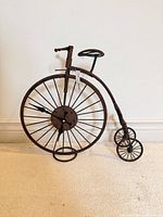 Front view showing bicycle form and clock face