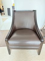 front view of brown faux leather accent chair