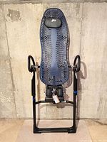 Front view of entire Hang Ups inversion table showing frame, backrest, ankle holders