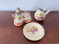 Overall view of creamer, plate and condiment set