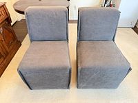 Front view of both gray slipper chairs