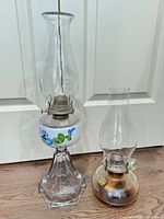 Both lamps side by side showing relative sizes, materials and condition