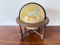 Replogle 18-inch tabletop globe on turned wood tripod stand, full view