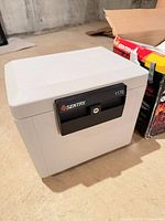 Closed Sentry 1170 safe front and side view