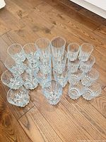 Semi-circle arrangement of all 18 glasses showing both sizes and base pattern