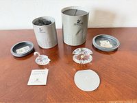 Overview of both figurines with boxes, lids, foam, certificate