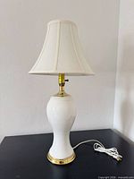 Full view of lamp showing body, shade, cord