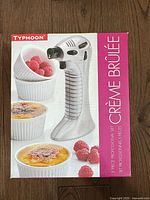 Front of retail box showing Typhoon brand, torch and ramekins