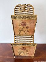 Front view showing two pockets with rose artwork and lattice back