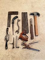Overall lot layout showing 12 hand tools