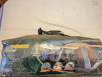 Front of packaged Woods Screenhouse showing graphics and carry bag