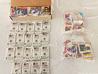 Overview showing sealed packs, box of loose cards, and two bags of cards