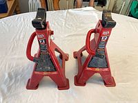 Front view of both red Big Red 2-ton steel jack stands