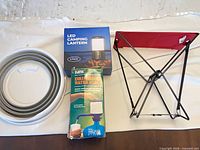 Group shot showing stool, lantern box, water pump box, collapsible bowl