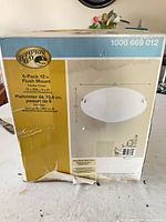 Damaged retail box for Hampton Bay 12" pewter flush mount ceiling lights