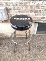 Full front view of Husky stool showing frame and seat