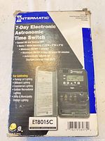 Front of worn retail box showing model ET8015C and image of timer