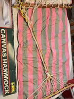 Hammock laid out showing full striped canvas, wood spreader bars, ropes, original Famous box