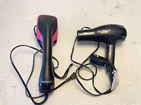 Revlon hair dryer and Hot Beauty hot air brush cords visible