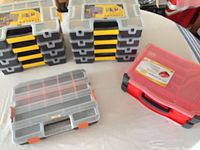 Stacked Stanley grey/yellow organizers with additional clear and red boxes visible