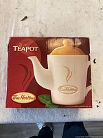 Front of retail box showing Tim Hortons 2-cup teapot image