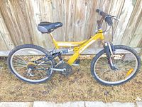Left side profile of yellow full-suspension mountain bike