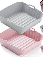 Grey and pink silicone air fryer liner trays showing shape and handles