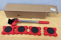 Box, lifter lever, four red sliders with black pads