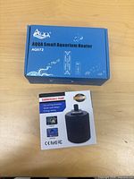 Retail boxes of AQQA AQ072 heater and submersible pump