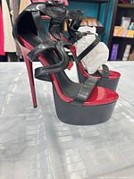 Side view of black and red platform stiletto sandals