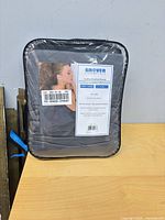 Front view of packaged Grover Essentials weighted blanket