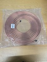 Full view of sealed copper-nickel tubing coil with end caps