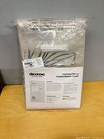 Front of sealed Deconovo curtain package showing size and style