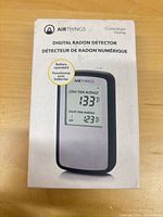 Front of sealed Airthings Corentium Home digital radon detector box