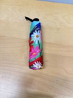 Folded umbrella full view on table