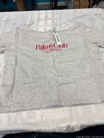 Front view showing graphic and hangtag attached