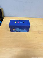 Top view showing four colour droplet icons on sealed box