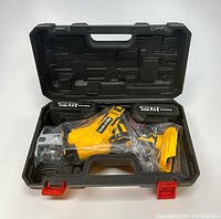 Open carry case showing reciprocating saw body and two batteries