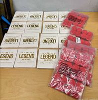 Overview of all sealed napkin packs and rose petal bags on table