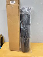 Bolster in sealed plastic beside original box