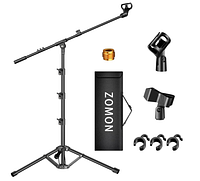 full contents of microphone stand set laid out, showing stand, boom, bag, clips, adapter