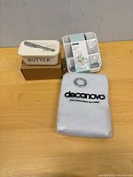 All three packaged items grouped on table